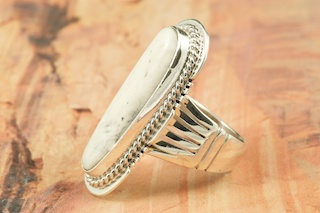 White Buffalo Turquoise set in Sterling Silver Ring. This Beautiful Stone is formed from the minerals Calcite and Iron. It is mined near Tonopah Nevada. Created by Navajo Artist John Nelson. Signed.
